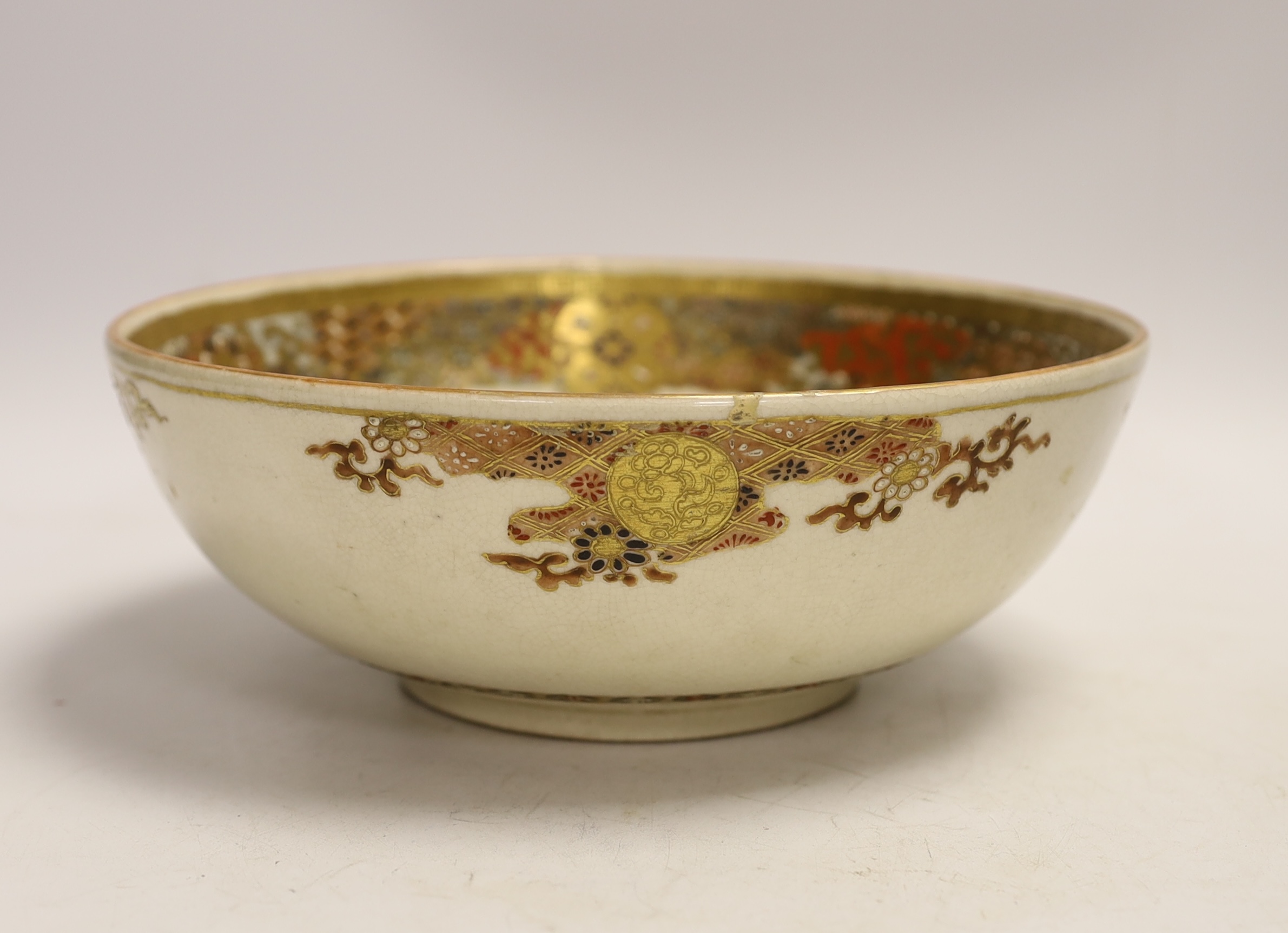 A Japanese Satsuma bowl, depicting Kinko riding a carp, Meiji period, impressed maker’s mark, 21.5cm diameter